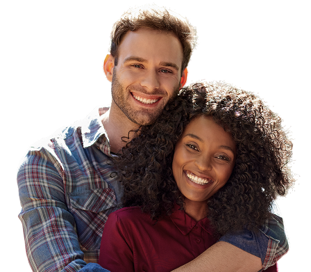 A man and a woman embrace while smiling for the camera