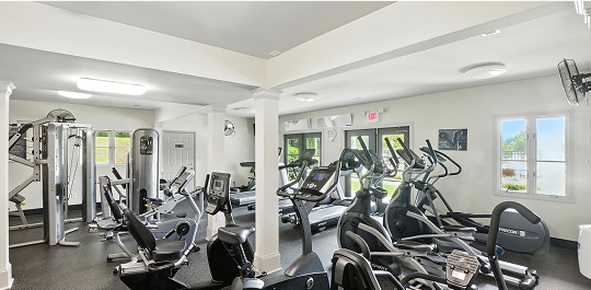 A gym for an apartment complex in Huntsville, Alabama with ellipticals and treadmills
