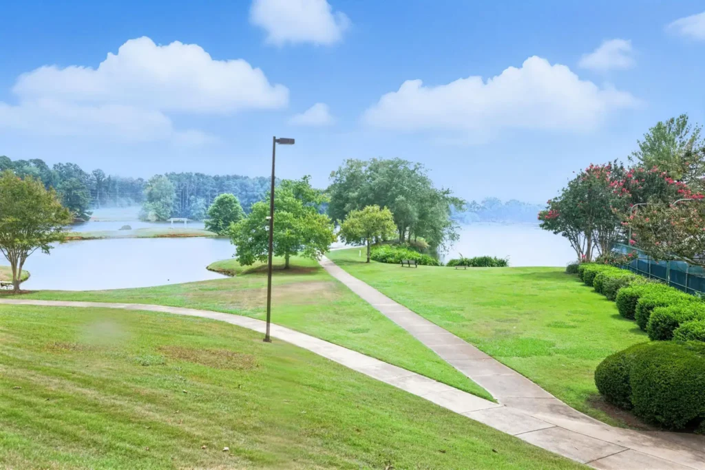 A walkway with two separate paths headed towards the lake
